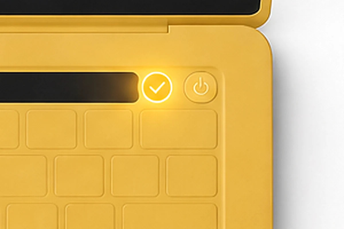 Close up of the lit amber checkmark beside the power key on a yellow Bolt